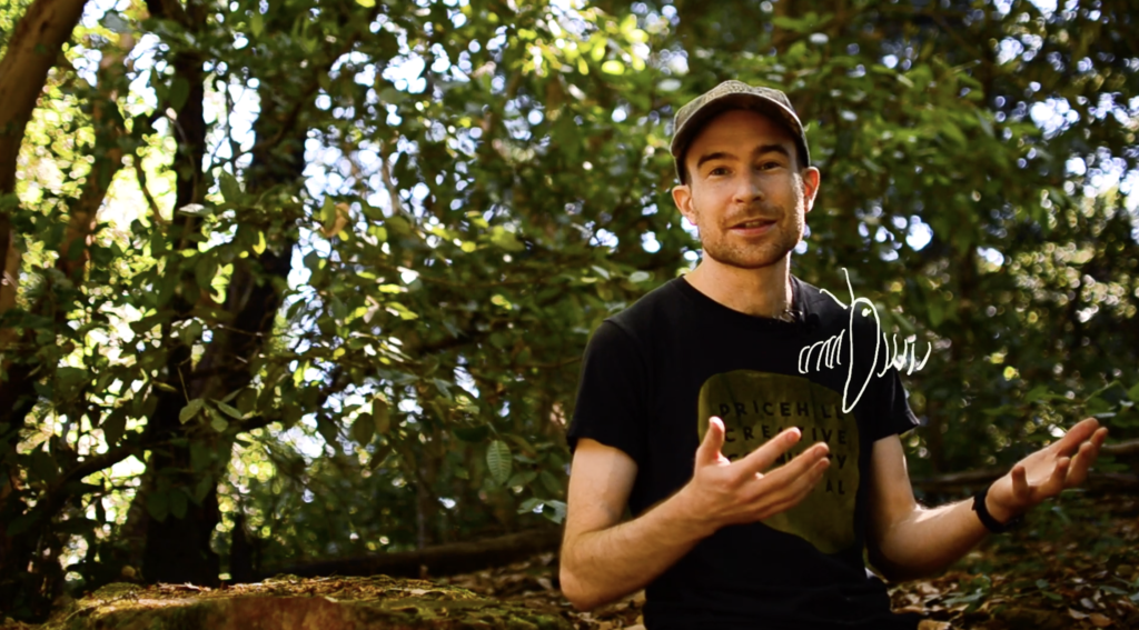 Nate in the woods with a cartoon hummingbird